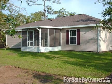 Beautiful Back of Home View! : Back of Home with Screened in Porch with Ceiling Fan, and yard!