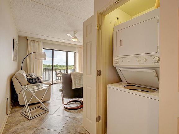 Stacked washer and dryer in hall closet