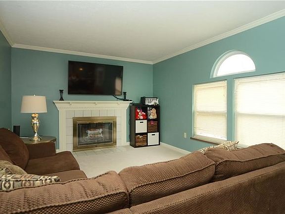 Living Room With Wood Burning Fireplace!