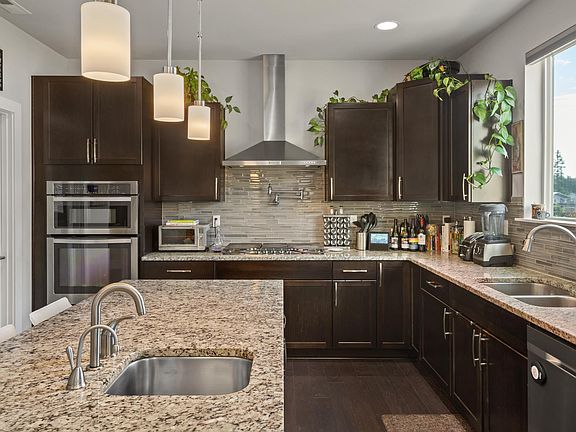 Gourmet kitchen, custom walk in pantry, dual sink with additional sink in island, soft tap faucet, instahot, pot filler, trash compactor