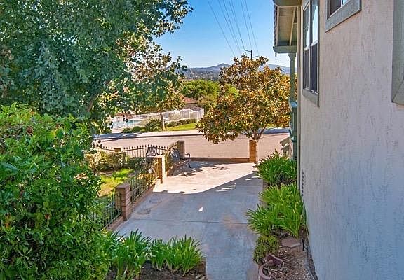 Outdoor Living: Relax on the balcony with your morning coffee, taking in the serene sunrise, or entertain on the large deck in the backyard, which provides elevated views of Escondido.