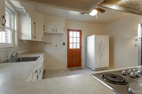 Kitchen view through dining room.