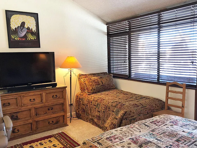 The master bedroom also has ha twin bed, a large 54" TV with soundbar and its own private balcony.