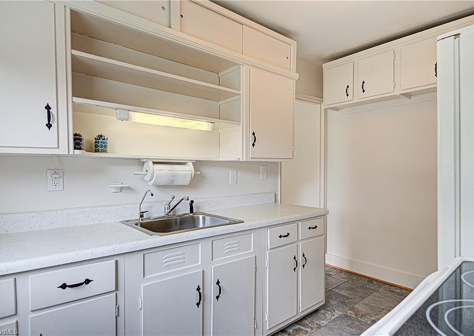 Kitchen viewed from the back door to the rear entrance of the building.
