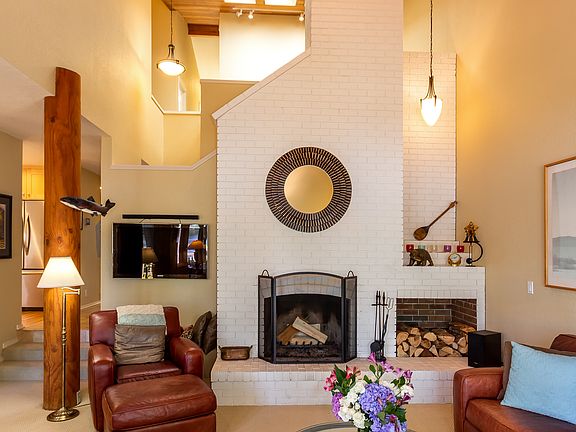 Vaulted ceiling with skylights above the landing. Firewood storage with seating. Plenty of wall space for your art!