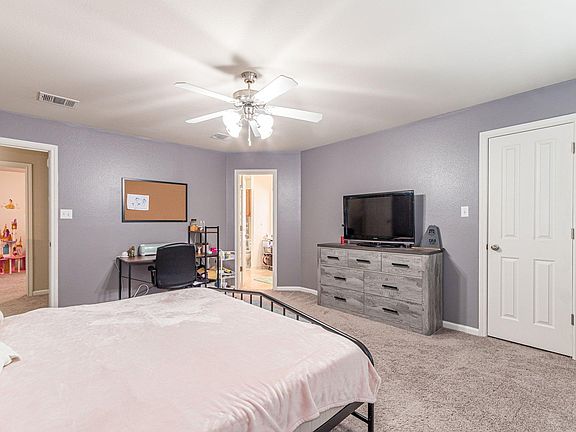 Upstairs primary bedroom, including en suite full bathroom and walk-in closet