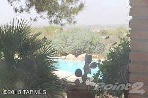 Glimpse of pool from patio.