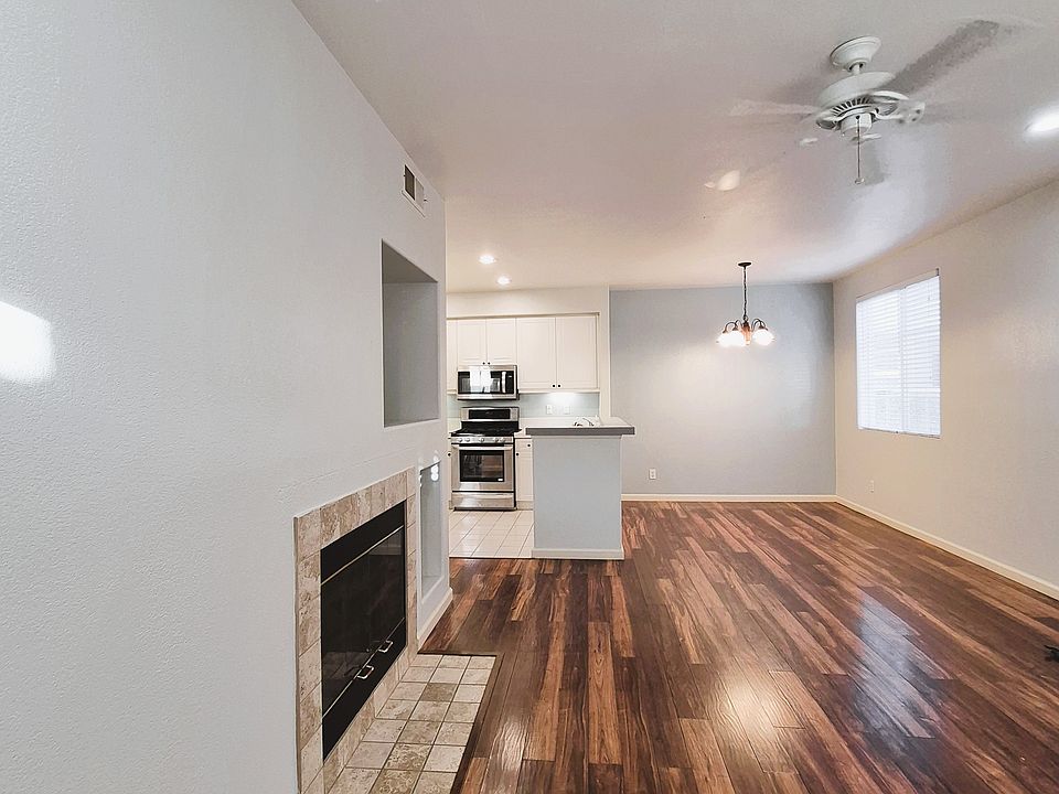 A welcoming entry reveals an open sightline into the living room, dining area, and kitchen, enhancing the home's flow