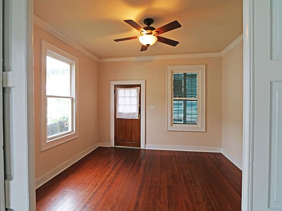 Living room viewed from bedroom with pocket doors between