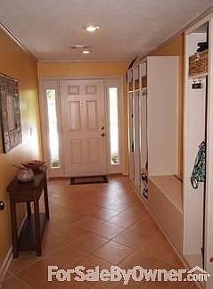 Mudroom for organizing the entire family : Beautifully tiled mudroom with six open lockers and bench