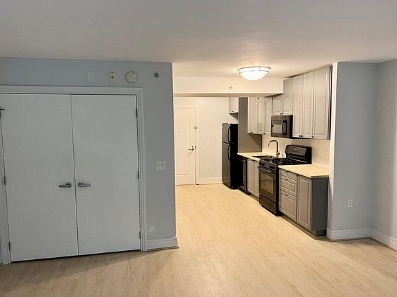 View from living room to kitchen and front door.
