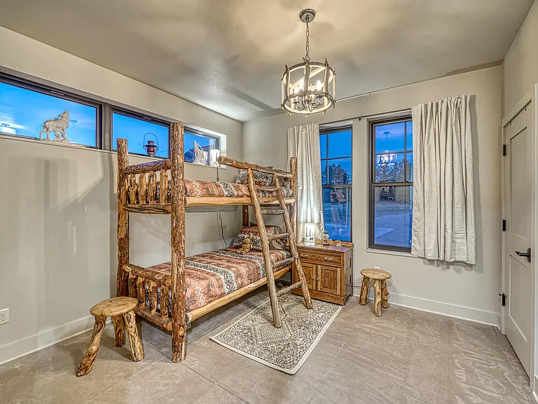 The Bear Cub Den with twin bunk beds, closet, and play area.