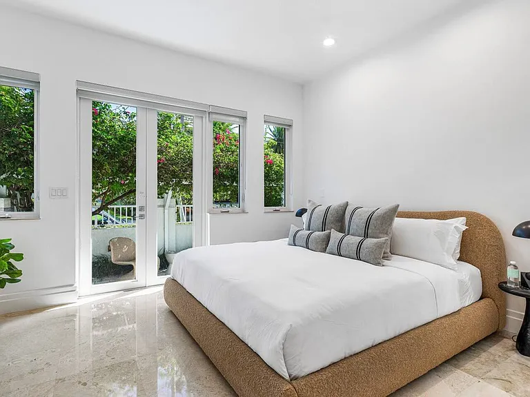 Serene guest bedroom with lush garden views designed for ultimate relaxation