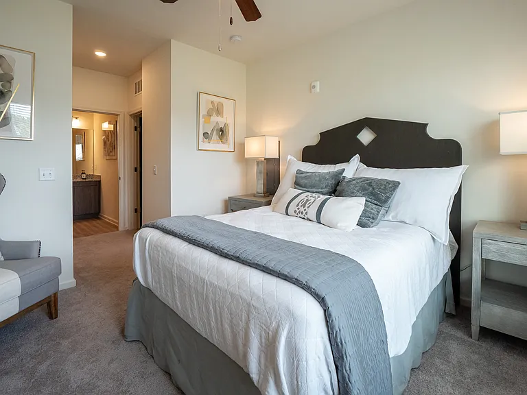 Bedroom with ceiling fan and carpet flooring