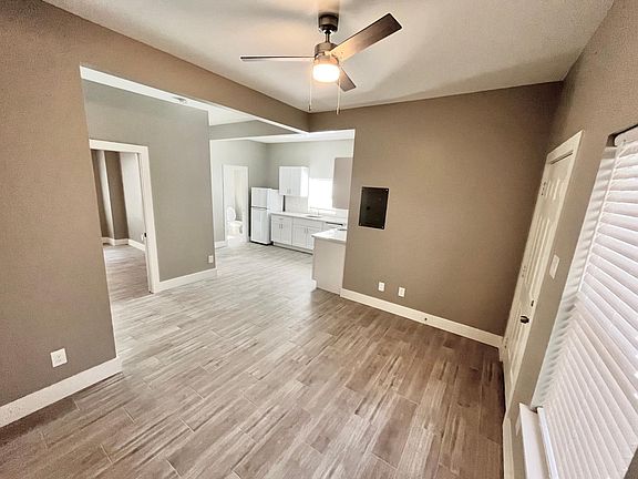 Living room and entry area, open concept to the kitchen.