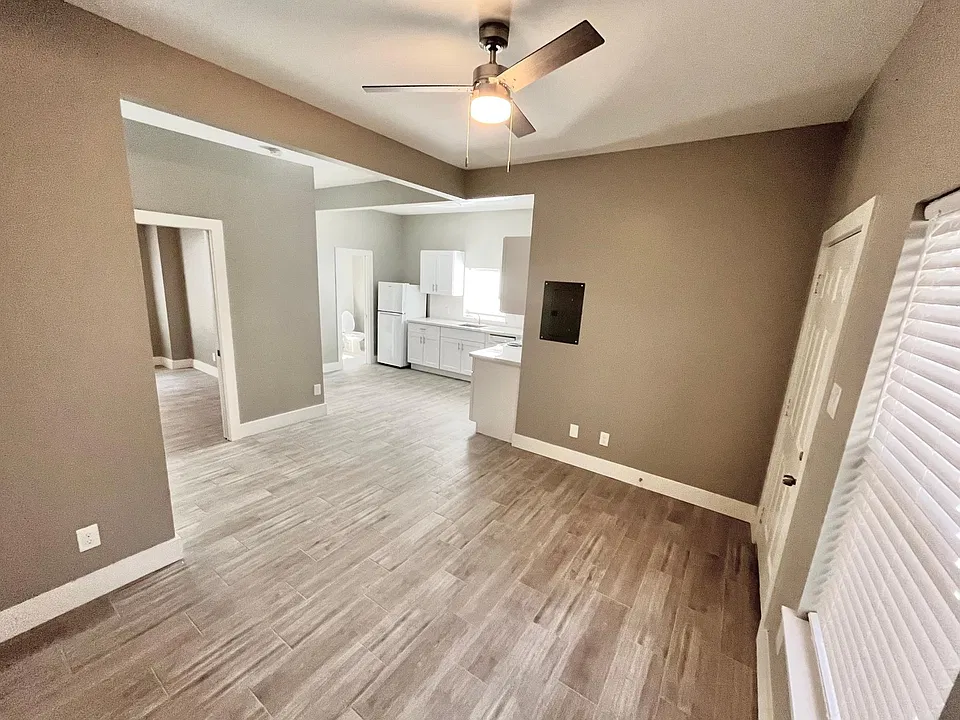 Living room and entry area, open concept to the kitchen.