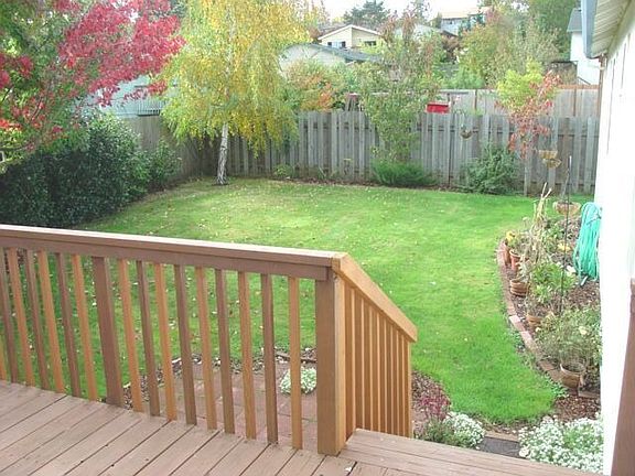 deck and large backyard