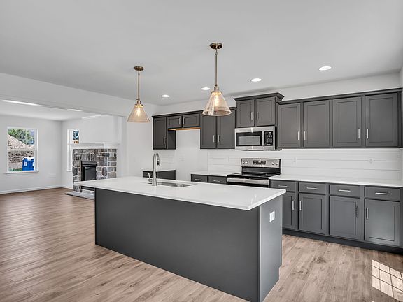 Kitchen with center island of the Charlotte Model from Garman Builders