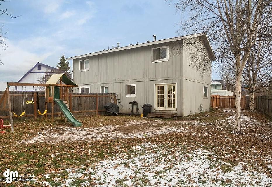 French doors leading to large fenced back and side yards