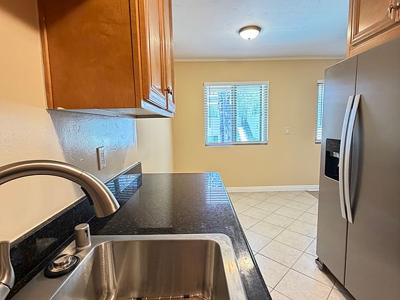 View from the kitchen showcases the open and inviting dining area.