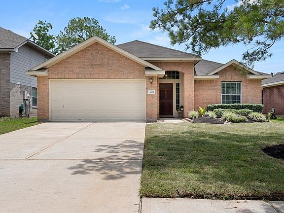 This amazing curb appeal makes this home a showstopper. Look at that inviting porch and freshly landscaped front yard.