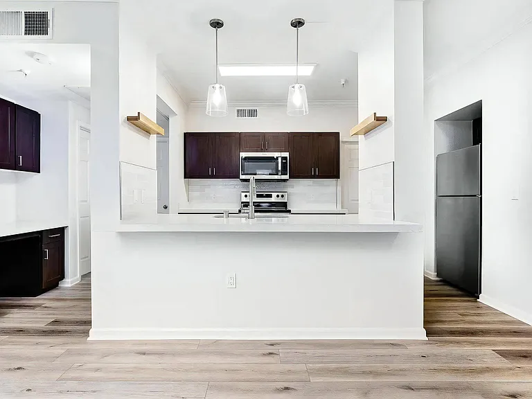 Spacious Kitchen with Island Counter and Built-In Work Desk