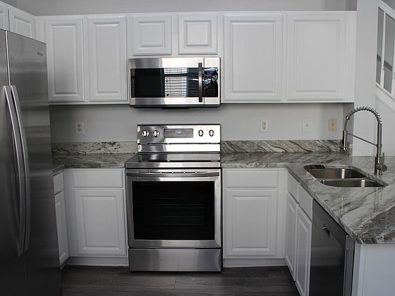 Kitchen with all brand new stainless steel appliances.