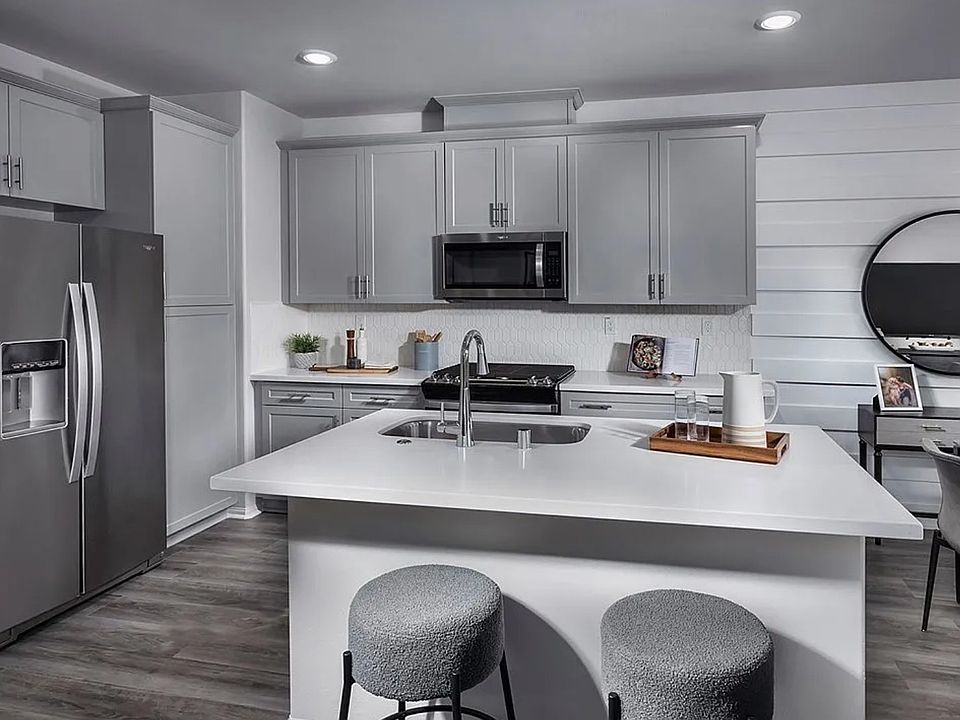 Modern kitchen with large island and brand-new stainless steel appliances