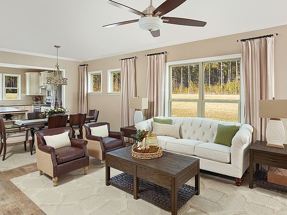 Airy gathering room open to kitchen and dining area are perfect for entertaining guests.