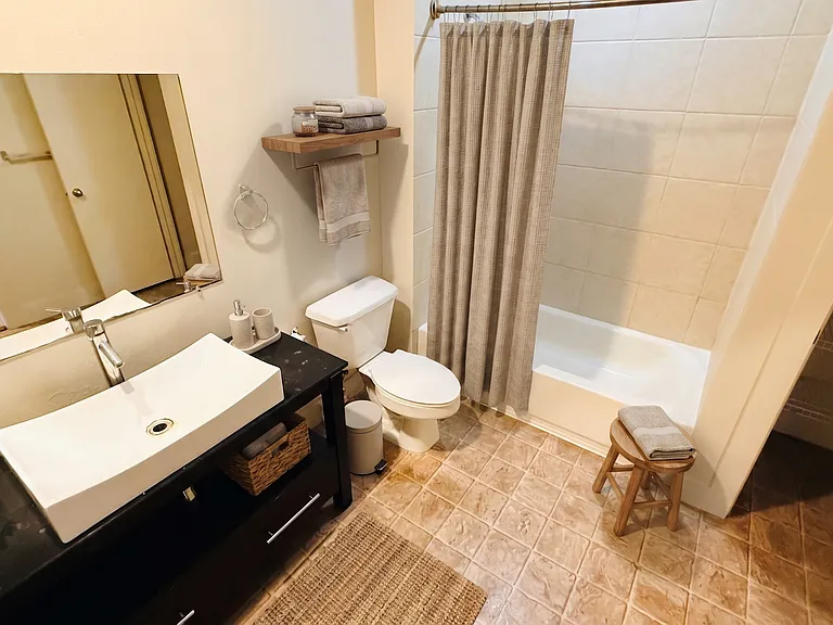 Extra Large Bathroom with a Beautiful Italian Lavatory, garden tub and linen closet.