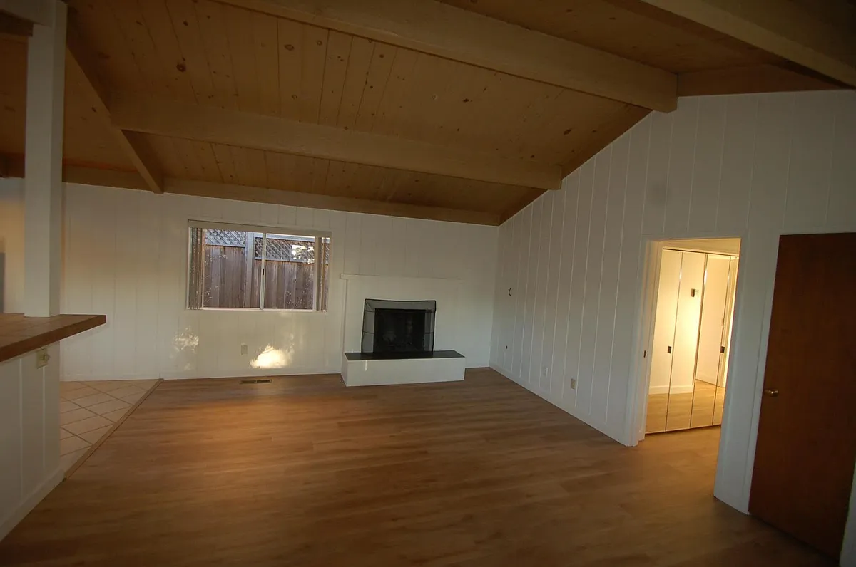 LIVING ROOM: Fireplace and high ceilings. - 24727 Dolores St