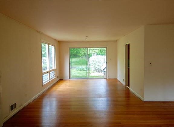 View of Dining Room with sliding glass doors to backyard patio.