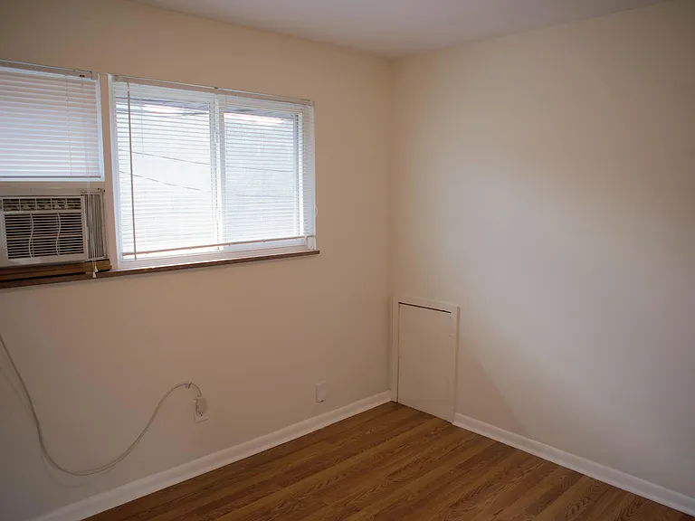 bedroom window with AC unit