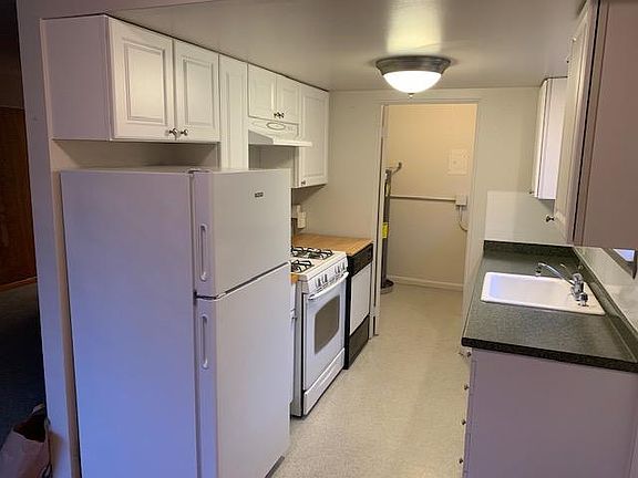 Kitchen looking into laundry room