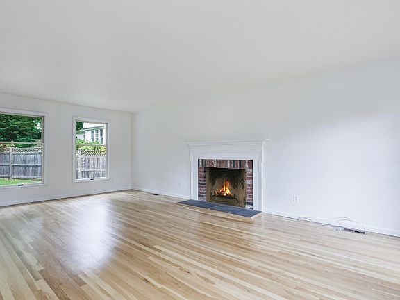 Living Room with Fireplace. Hardwood Floors.