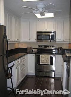 Kitchen View from entrance hallway : Kitchen appliances are included and have transferable warranty.
