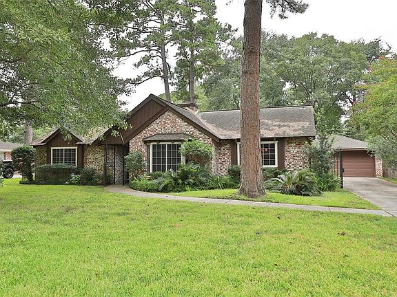 Two car detached garage with gated driveway - perfect play area for kids.