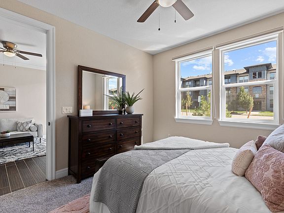 Plank flooring in common areas and plush carpeting in bedrooms