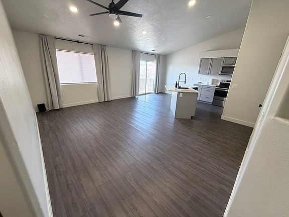 Large living and dining area with access to the back deck