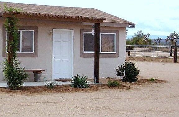 views of the round pen past the Guest house.