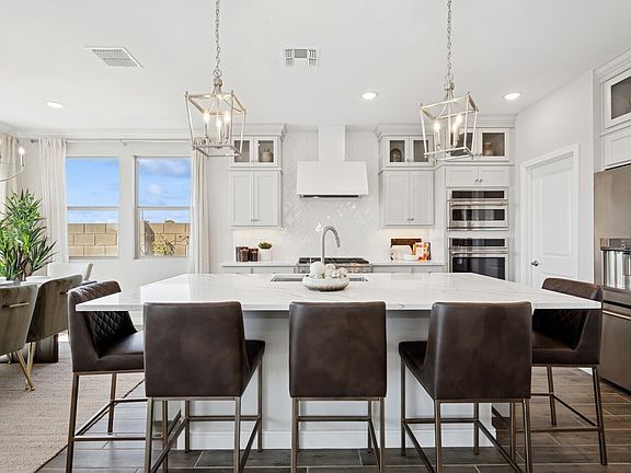 Glass upper cabinets and pendant lighting