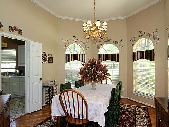 Off the foyer enter into the formal dining room. Bay windows and convenient access to the kitchen for ease of serving your guests.