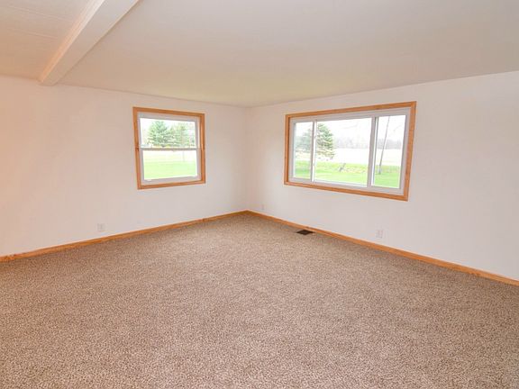 Huge living room with new vinyl windows and tons of natural sunlight. Great space for entertaining the family or watching the ball game.