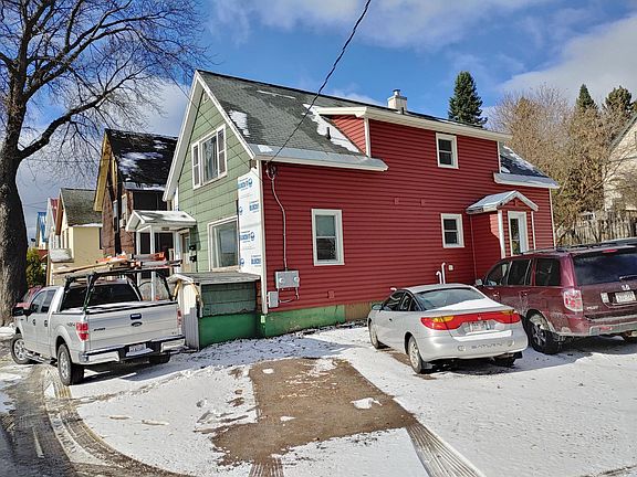 Front and side of house and some parking shown from street Front and side view from street (front of house siding and foundation painting will be completed before occupants move in)
