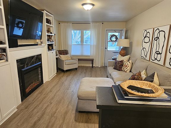 Living room. Window includes cellular blinds.