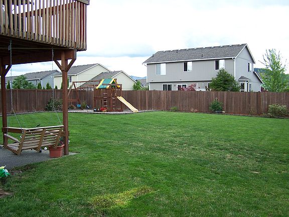 Large backyard with playset