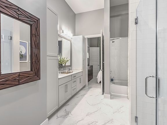 Luxurious bathrooms with walk-in showers and soaking tubs