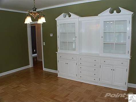 Just off kitchen, adjacent to sunroom