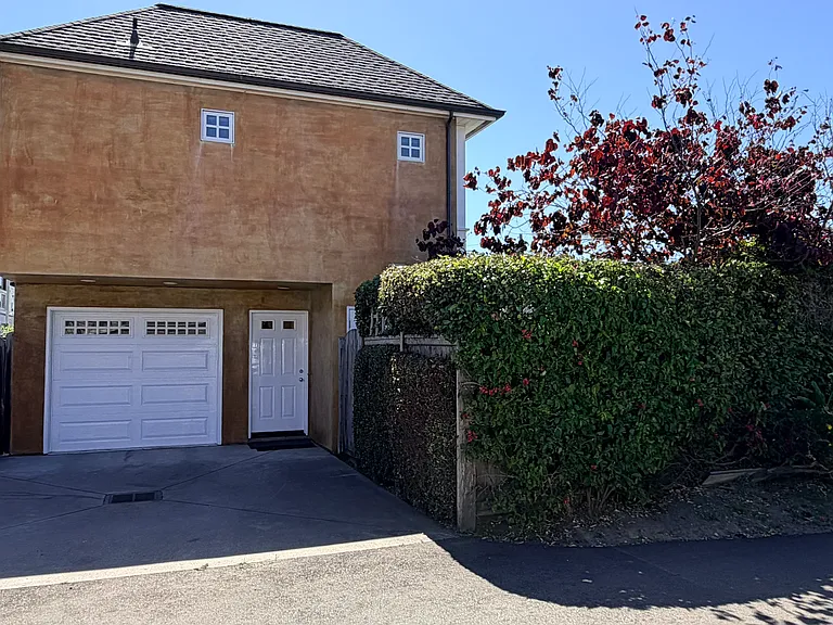 Garage accessed by private alley. Rear access