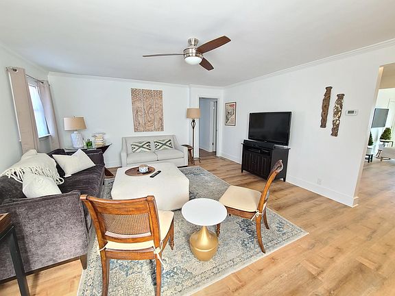 The living room now has upgraded occasional chairs and a fireplace and an 80 inch TV (sorry old pic on this one)